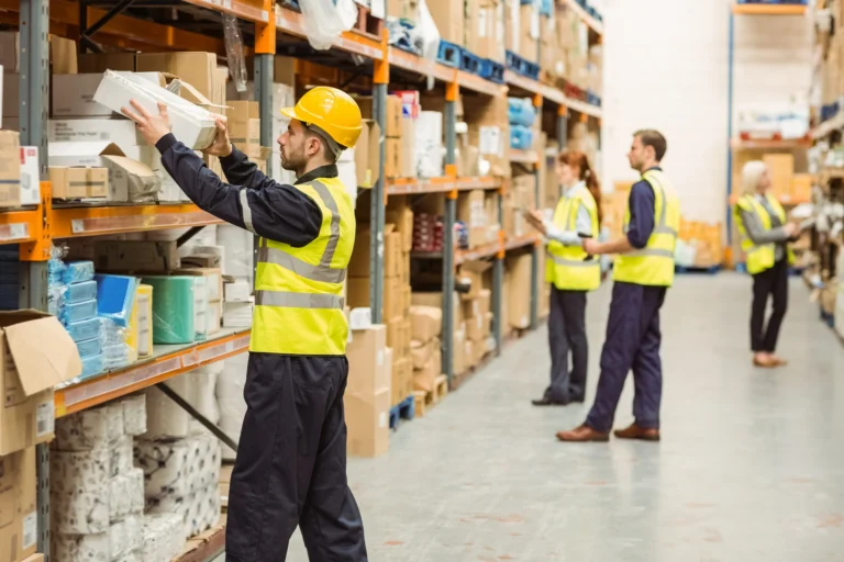 Logistics Warehouse: Workers are counting inventory.
